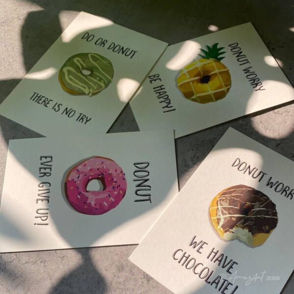 Mood image of original AmuzAnt Donut Greeting Cards. 4 Greeting cards with donut illustrations.