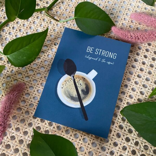 Mood image of the "Be strong (whispered to the coffee)" AmuzAnt Greeting card. The card has a coffee illustration.