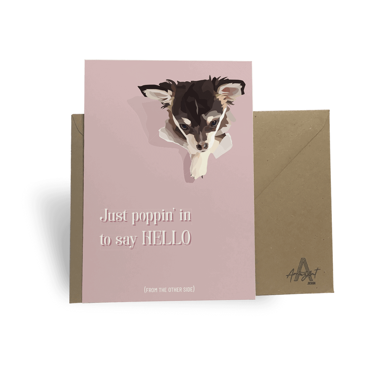 Original greeting card from AmuzAnt Design with the text: "Just poppin' in to say Hello" and a drawing of a chihuahua punching through the pink paper background. The card is leaning against a recycled craft envelope.
